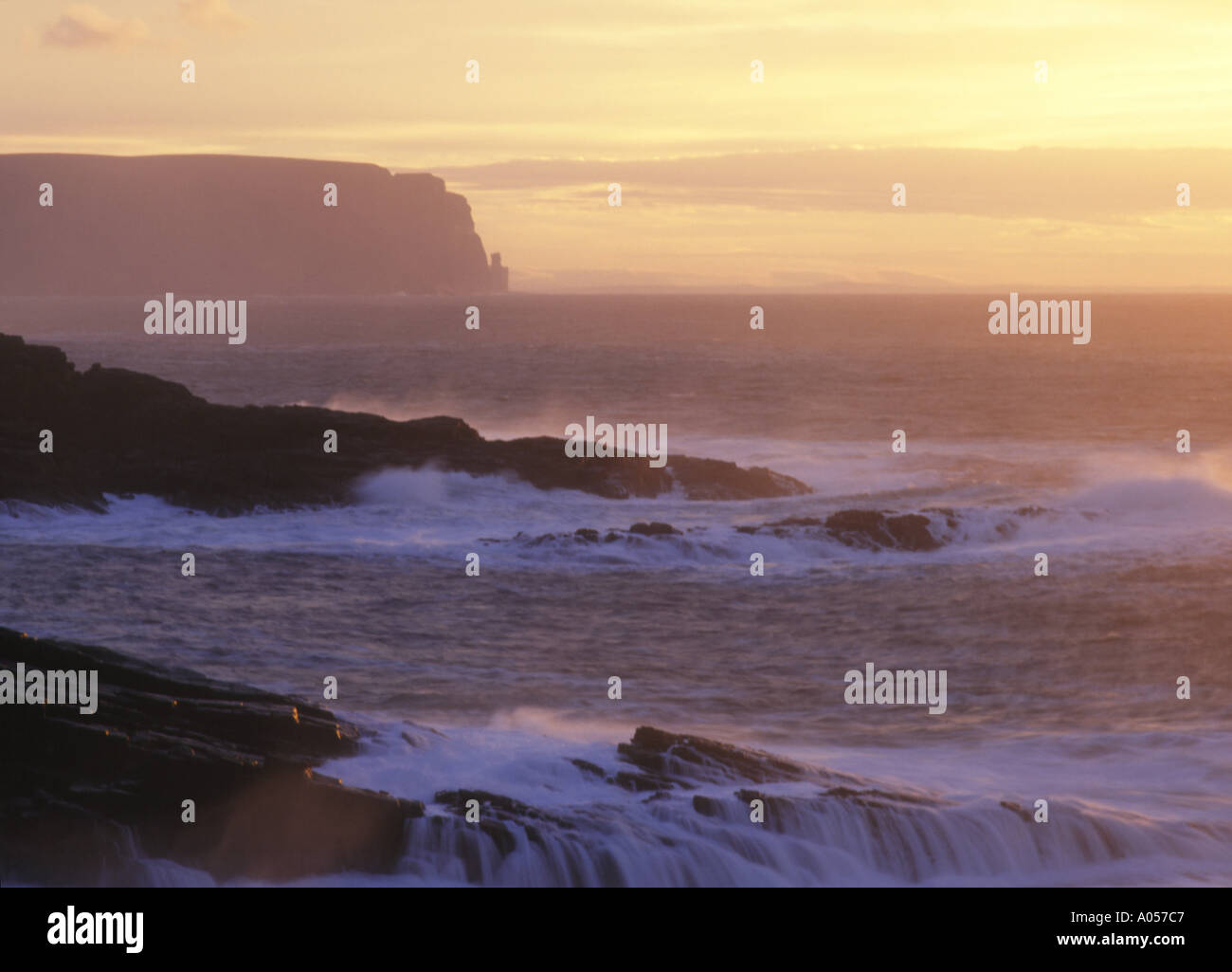 dh Qui Ayre YESNABY ORKNEY Stormy sea waves coastal rocks sunset Atlantic Ocean pink dusk seacoast seascape surf rough storm coast scotland littoral Stock Photo