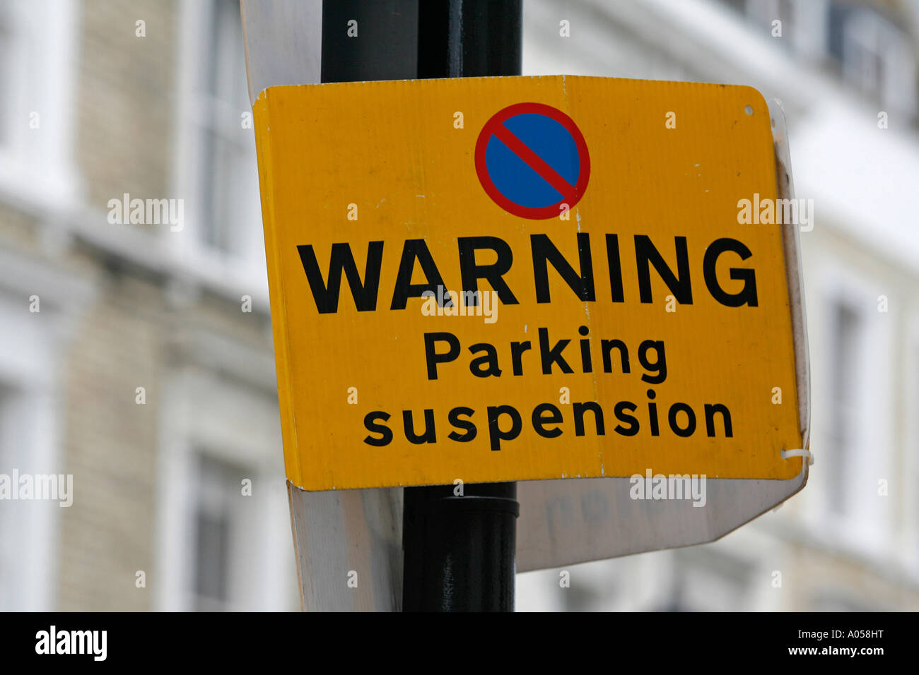 Sign reading Warning Parking Suspension attached to a lamppost Royal