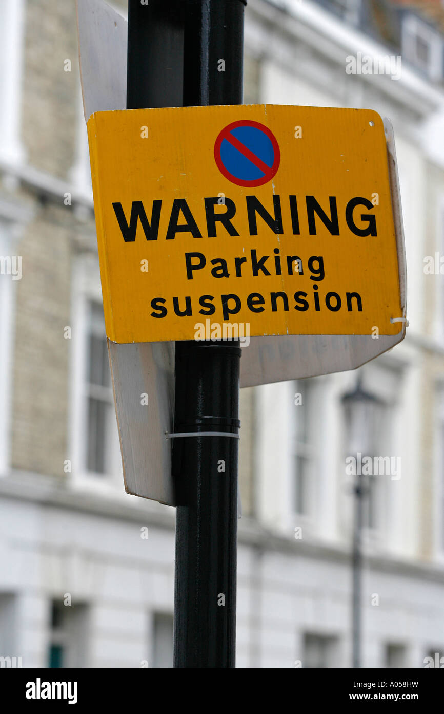 Sign reading Warning Parking Suspension attached to a lamppost Royal