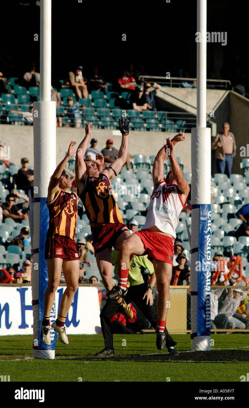 Players jumping to mark (catch) the ball in Australian Rules Football match at the now demolished Subiaco Oval, Subiaco, Western Australia 2006 Stock Photo
