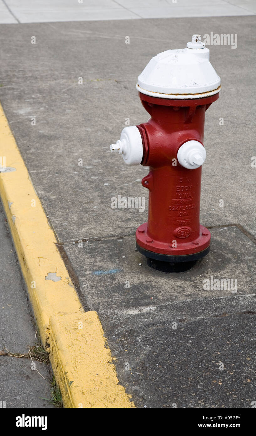 Red painted fire hydrant at kerbside Bellingham USA Stock Photo