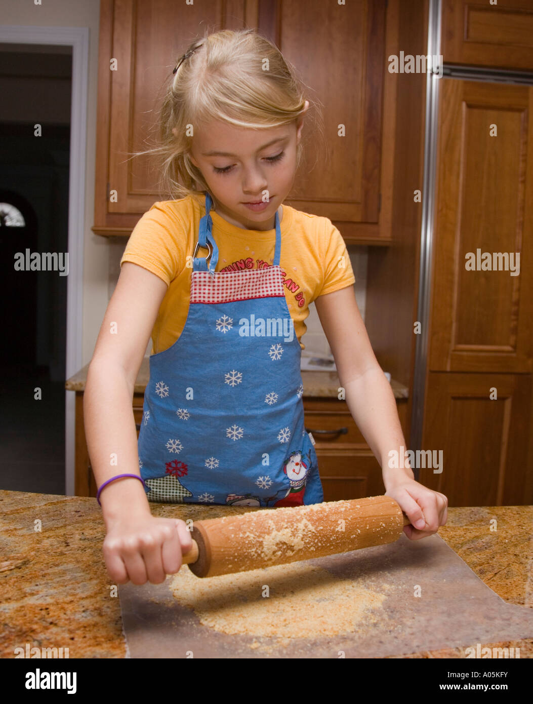 Child using a rolling pin Stock Photo Alamy