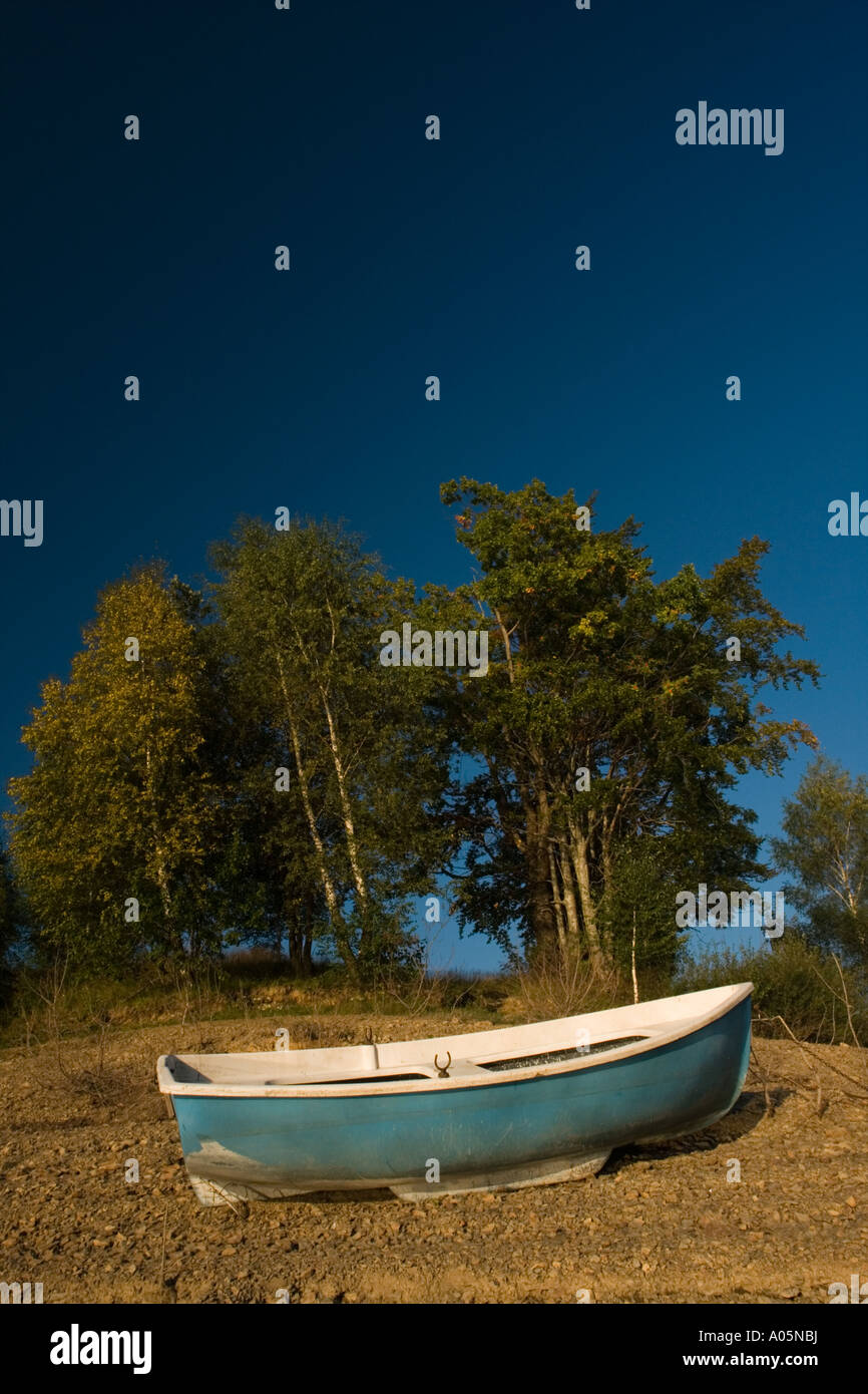 Boat ashore on dry coastline Stock Photo