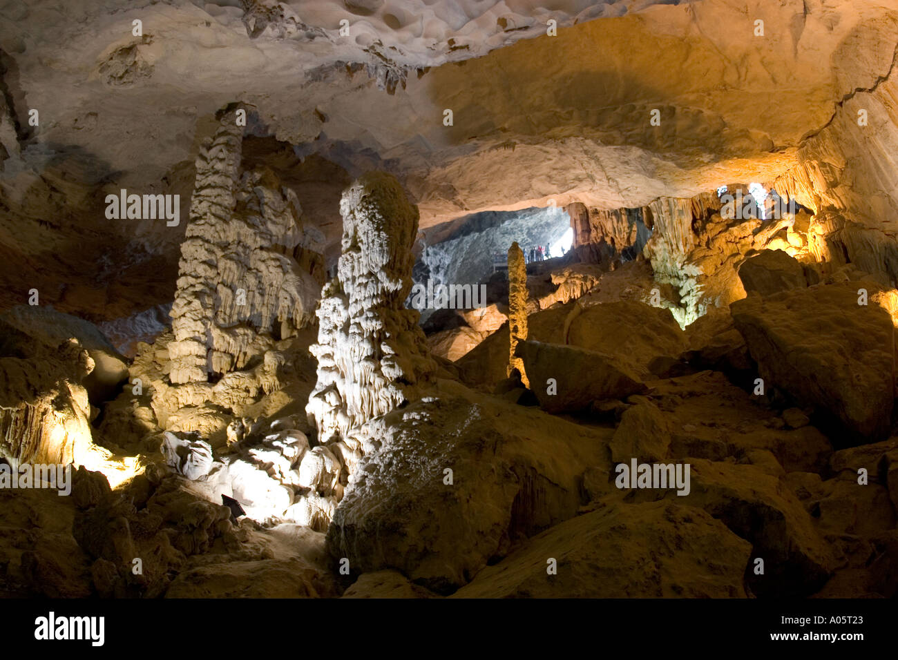 Vietnam northeast Halong Bay Hang Sung Sot cave illuminated underground stalactites and stalagmites near mouth of cave Stock Photo