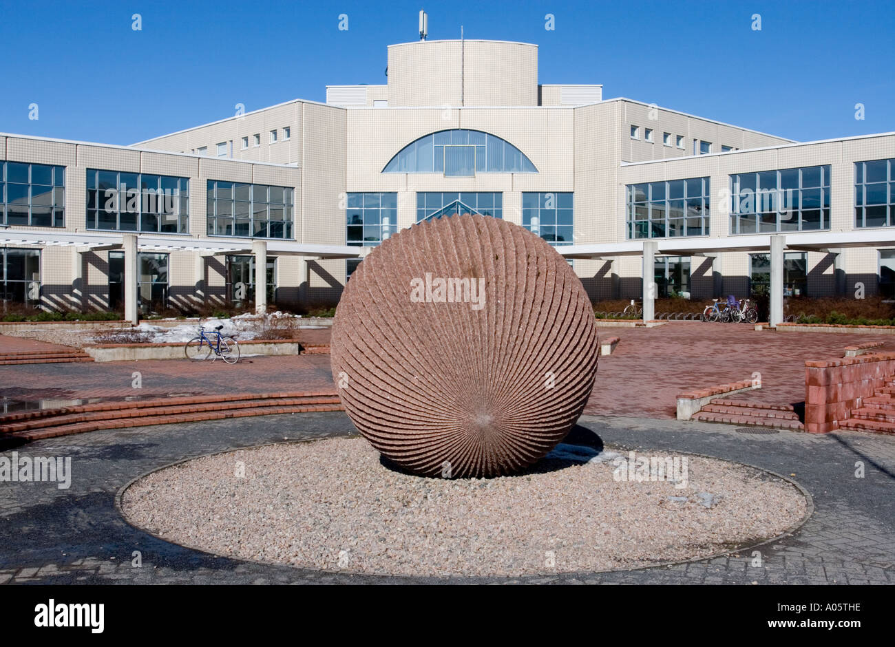 Massive engraved red granite ball at the entrance of the Oulu University ( Oulun yliopiston kirjasto ) library , Finland Stock Photo