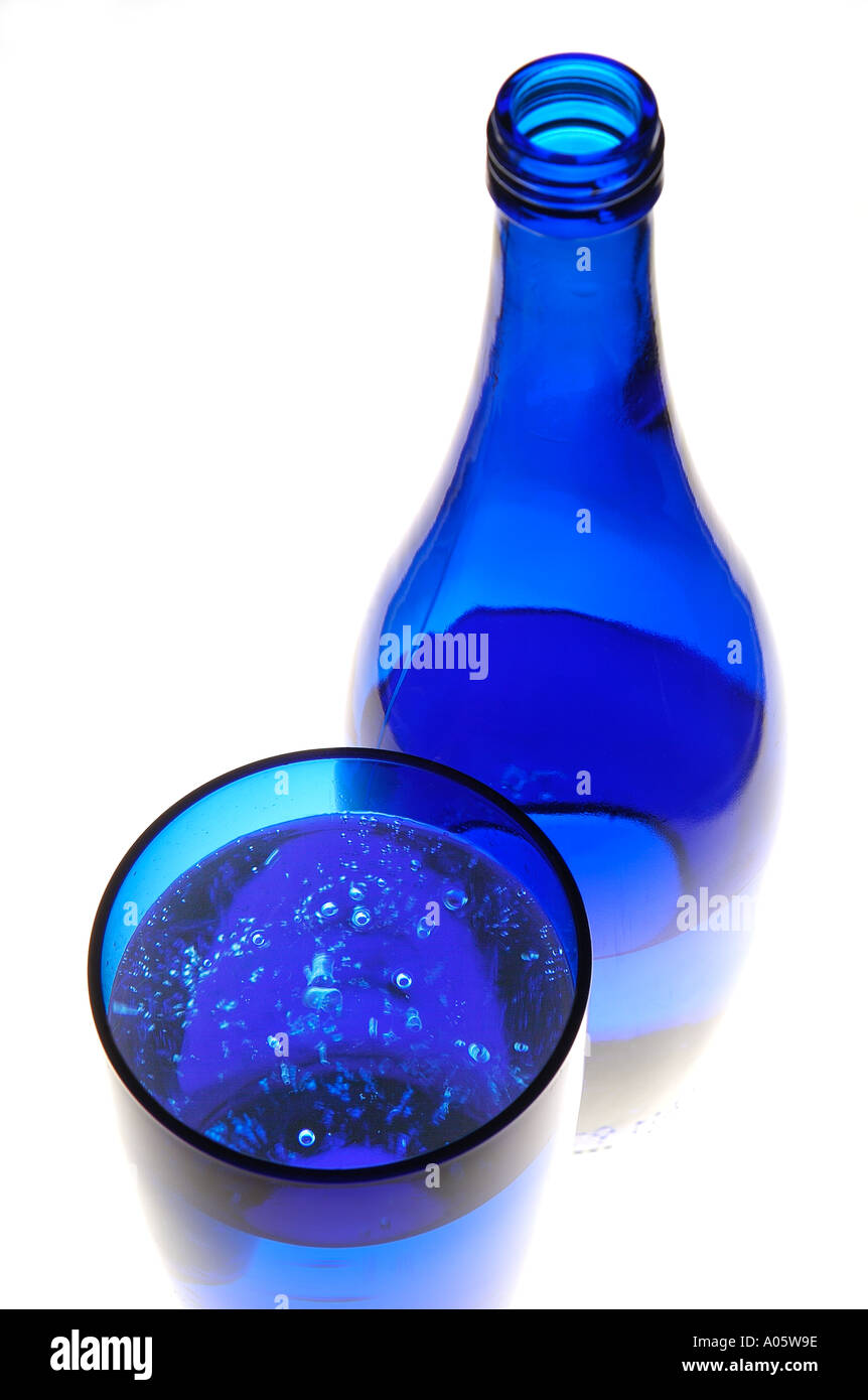 bottle of sparkling mineral water in blue glass Stock Photo - Alamy