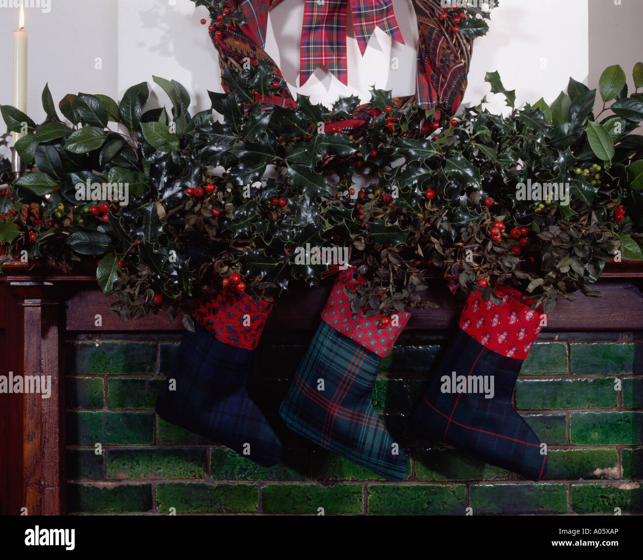 Close Up Of Mantelpiece Decorated For Christmas With Holly And