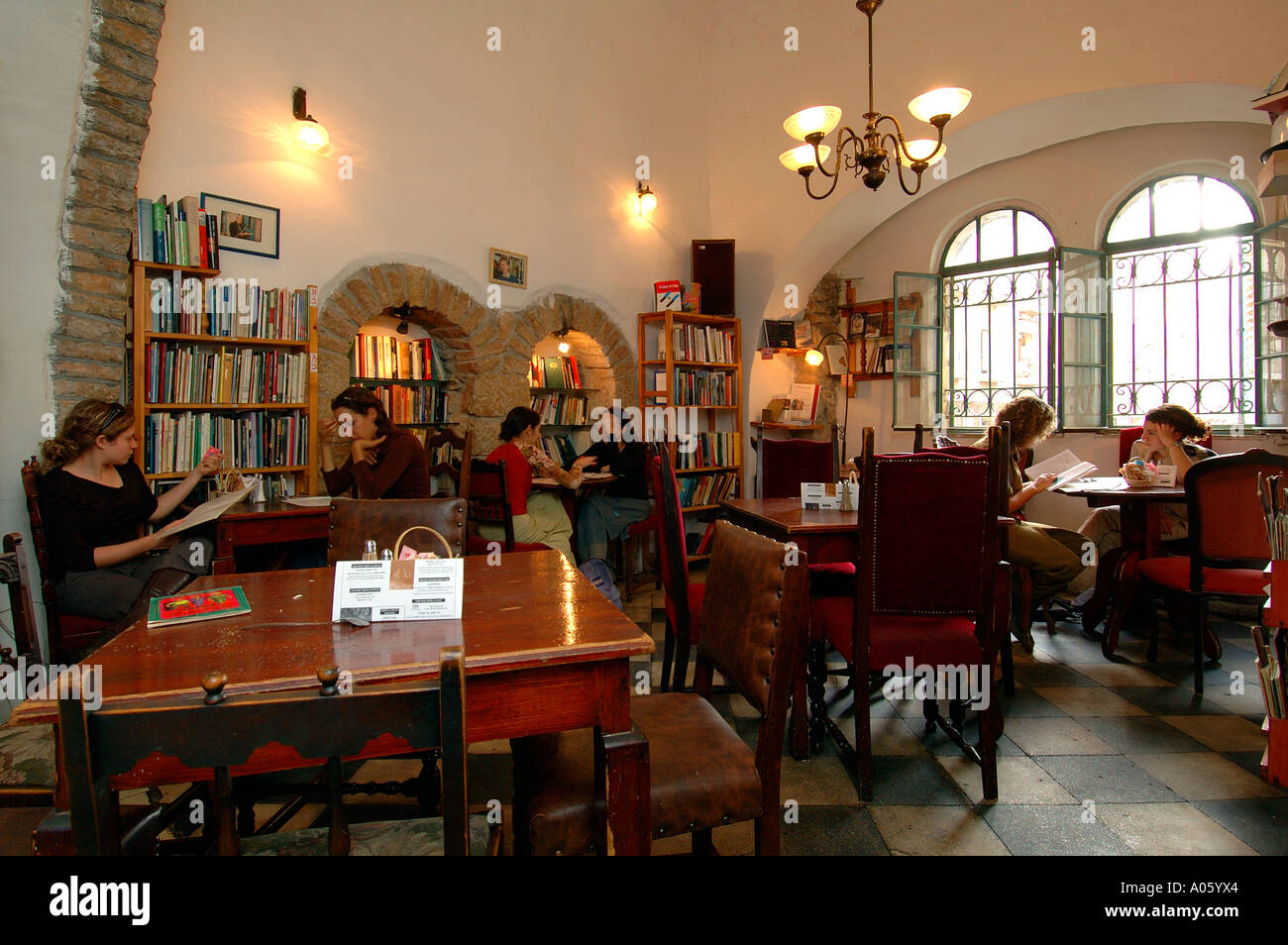 Students reading books inside Tmol Shilshom cafe located in Yo'el Moshe  Salomon street in downtown West Jerusalem Israel Stock Photo - Alamy