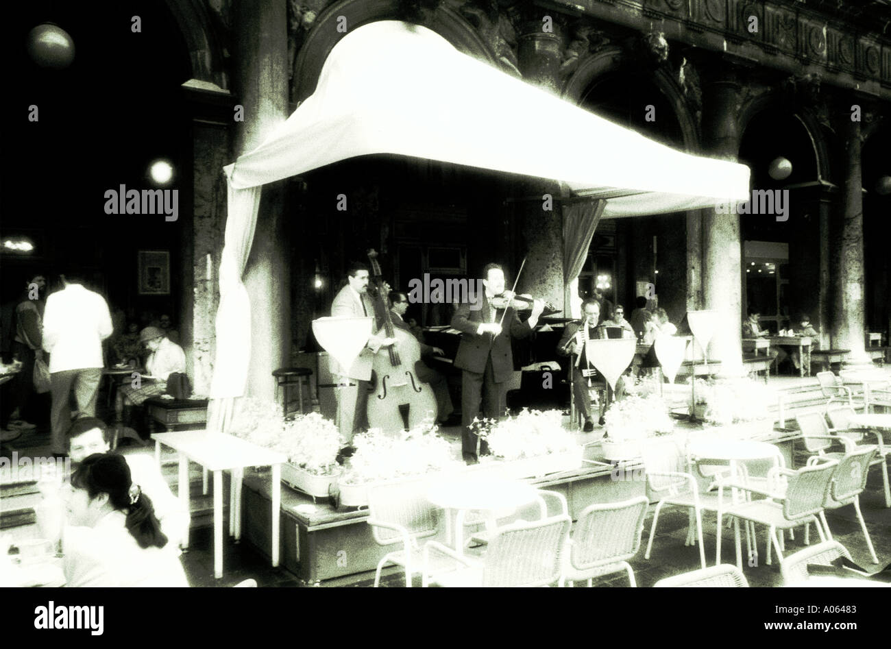 Italy Venice musicians in cafe black and white infrared Stock Photo