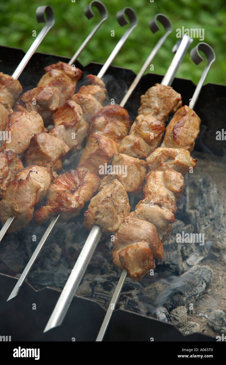 High angle view of pieces of meat seen roasted on the skewer Stock Photo