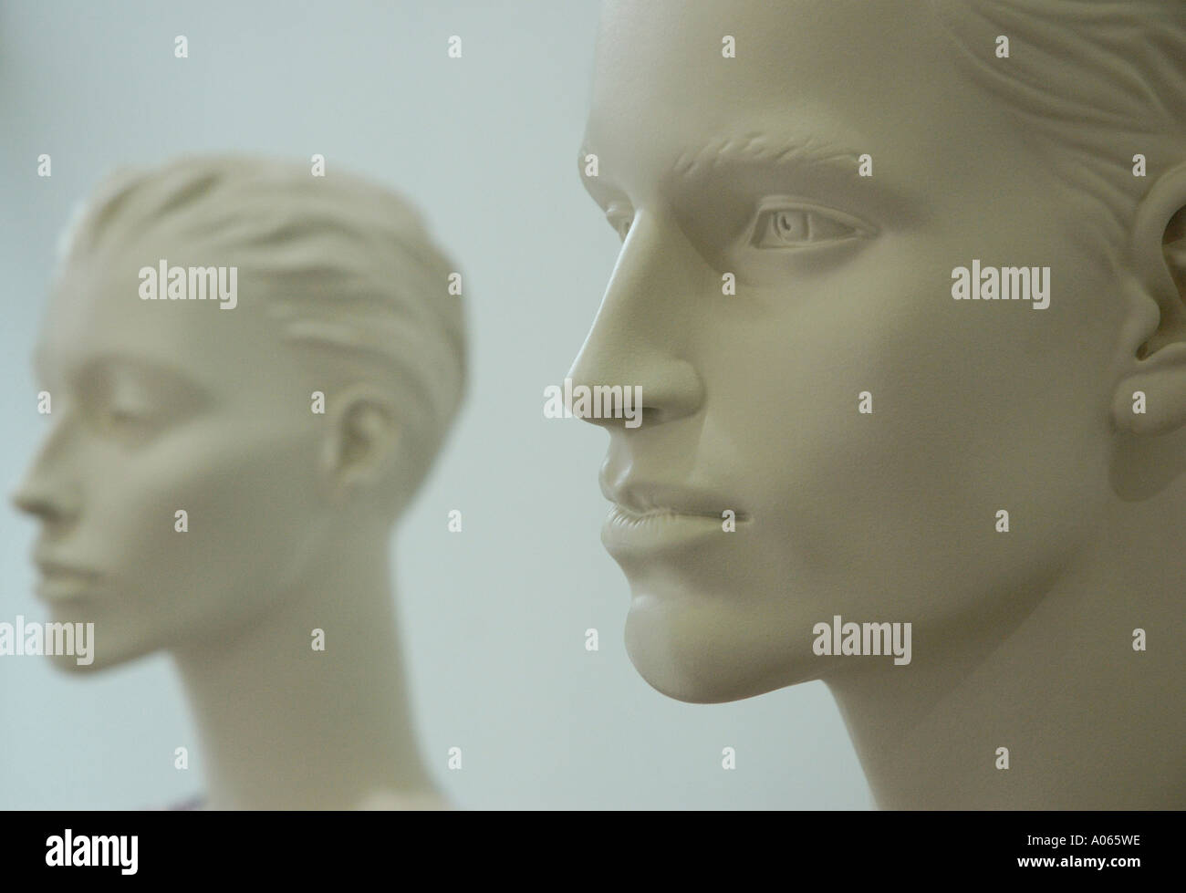 Side view of two carved human faces Stock Photo Alamy