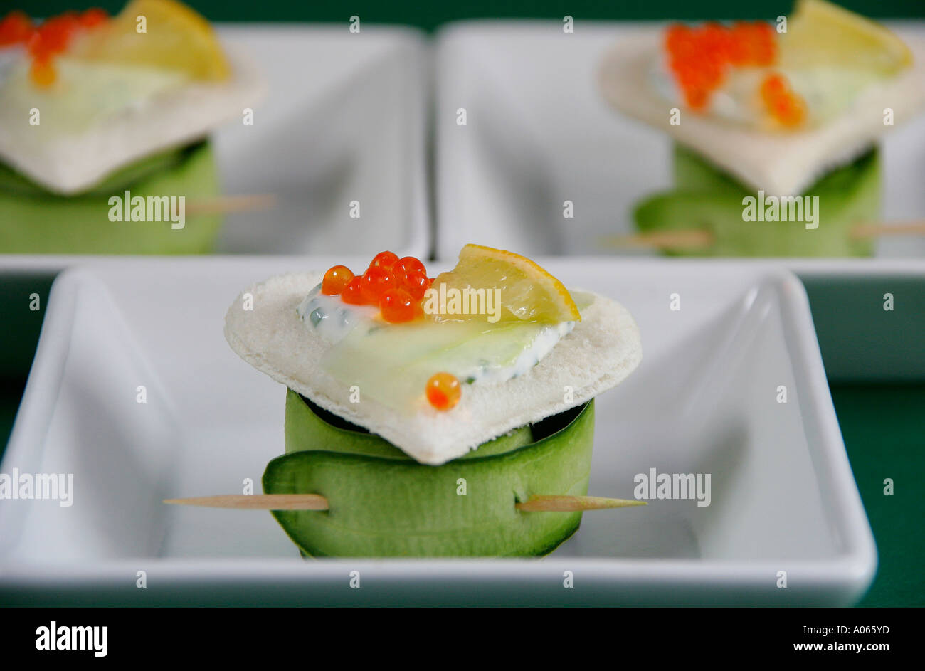 Leaf roll placed below a heart shaped garnished foodstuff is seen at close up Stock Photo