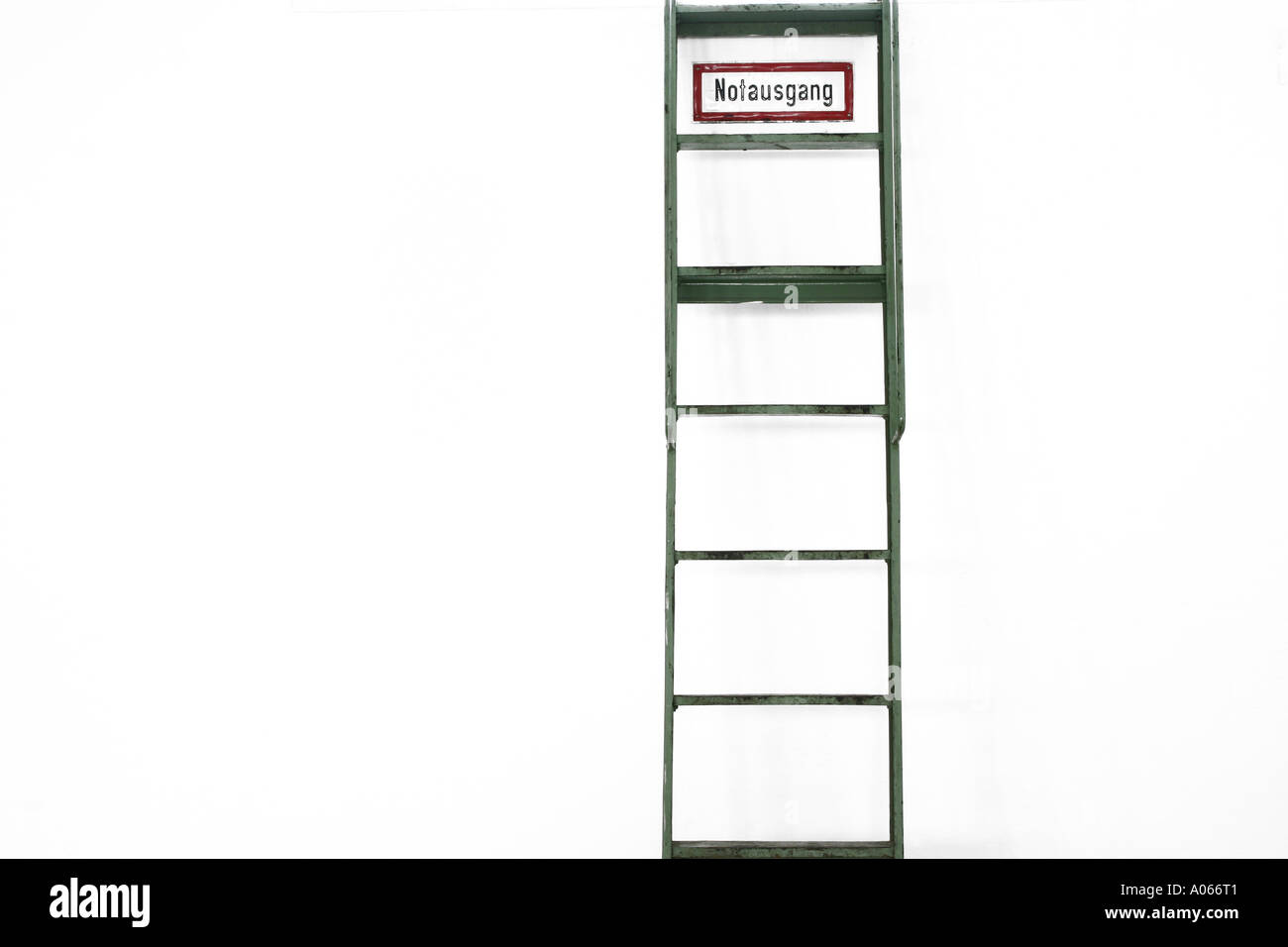 Front view of a stepladder with a escape hatch board at the top Stock Photo