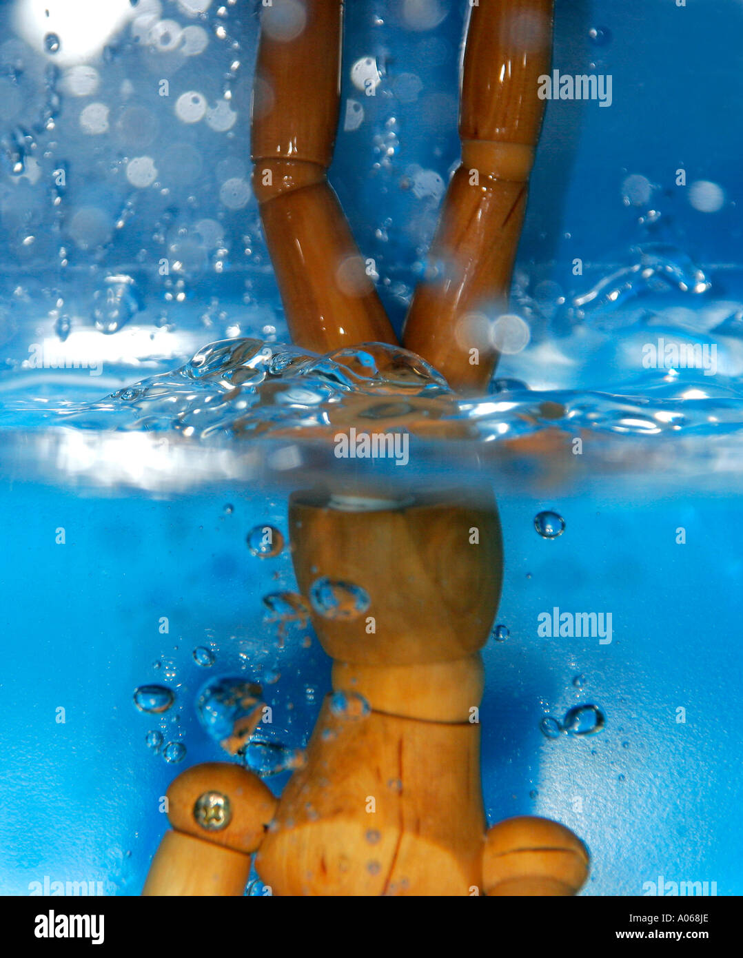 A wooden artifact immersed in water Stock Photo