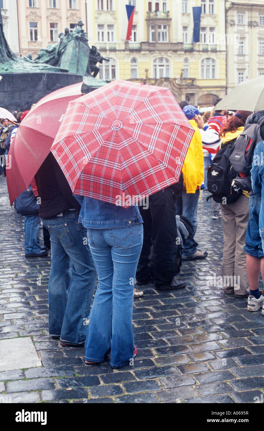People with umbrellas in Prague Stock Photo