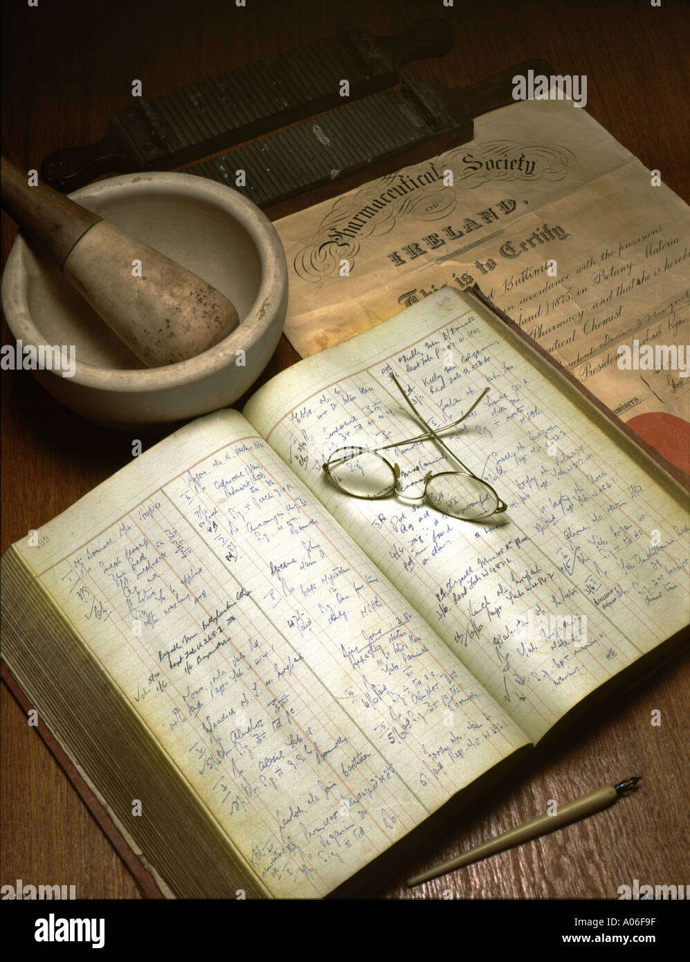 An old pharmacy prescription book with Mortise and Pedestal Stock Photo