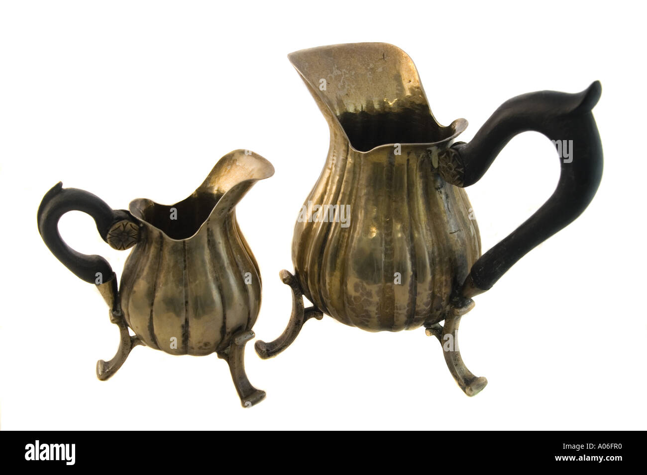 Two Antique Silver Pitchers isolated on white background Stock Photo