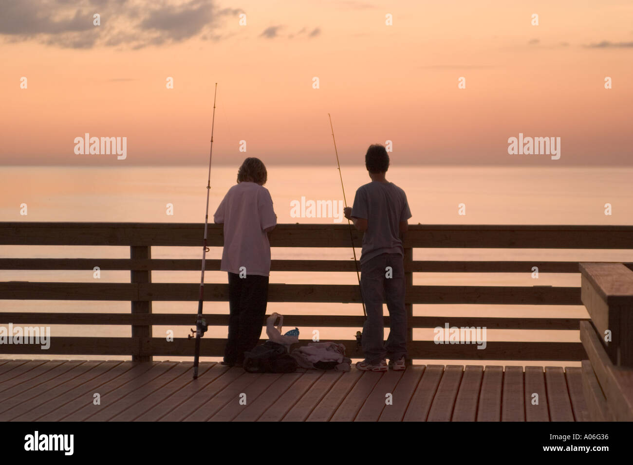 Two boys fishing coast hi-res stock photography and images - Alamy
