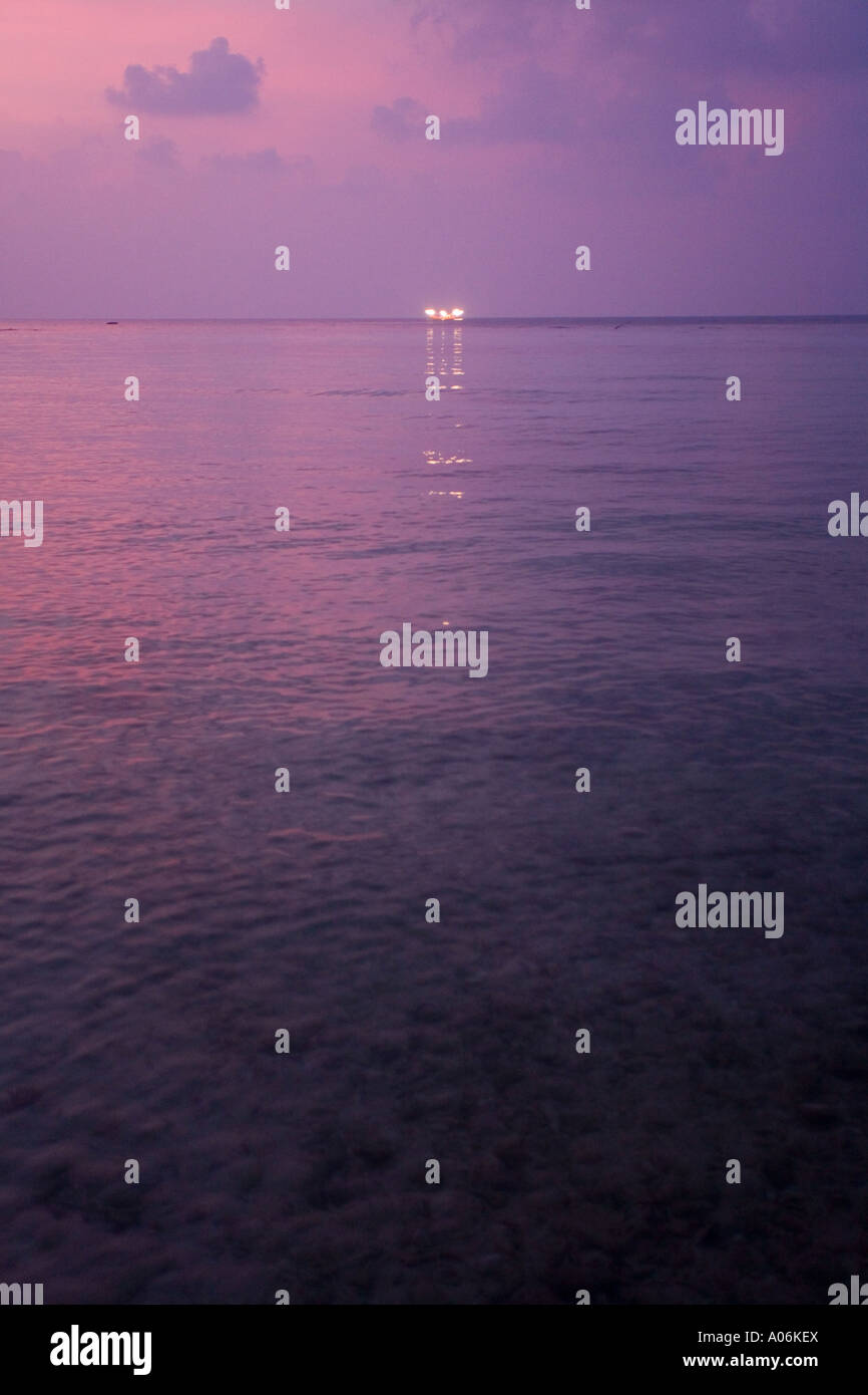 Squid boat on the horizon using bright lights to attract squid into its