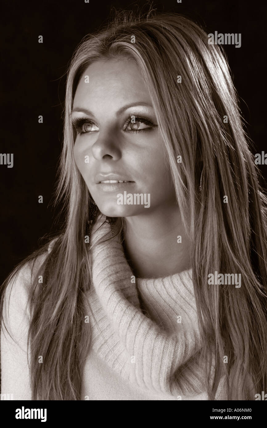 Sepia Portrait of a Blonde Girl Wearing a Jumper Stock Photo