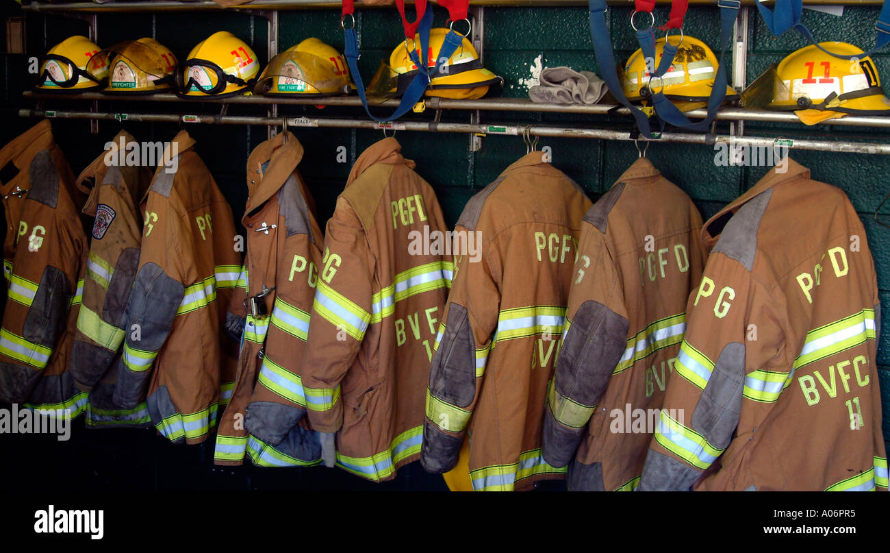 Firefighters turnout gear hang on a rack inside the Branchville Vol Fire Dept in College Park Md Stock Photo
