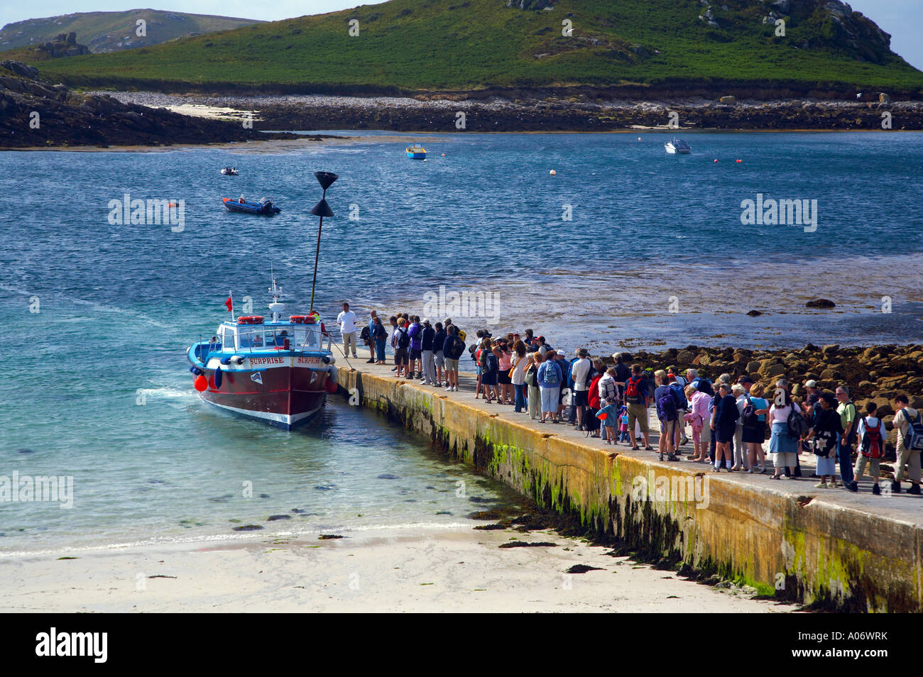 Daytrip visitors queuing to board a pleasure boat on Lower Town Quay