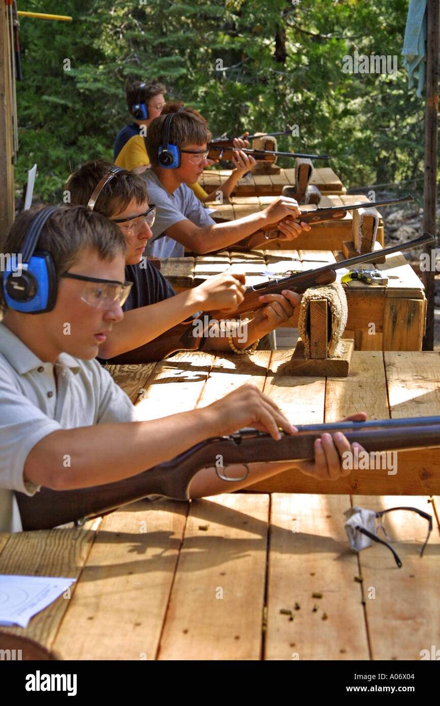 Learning to aim a 22 caliber rifle from the beginning Stock Photo - Alamy