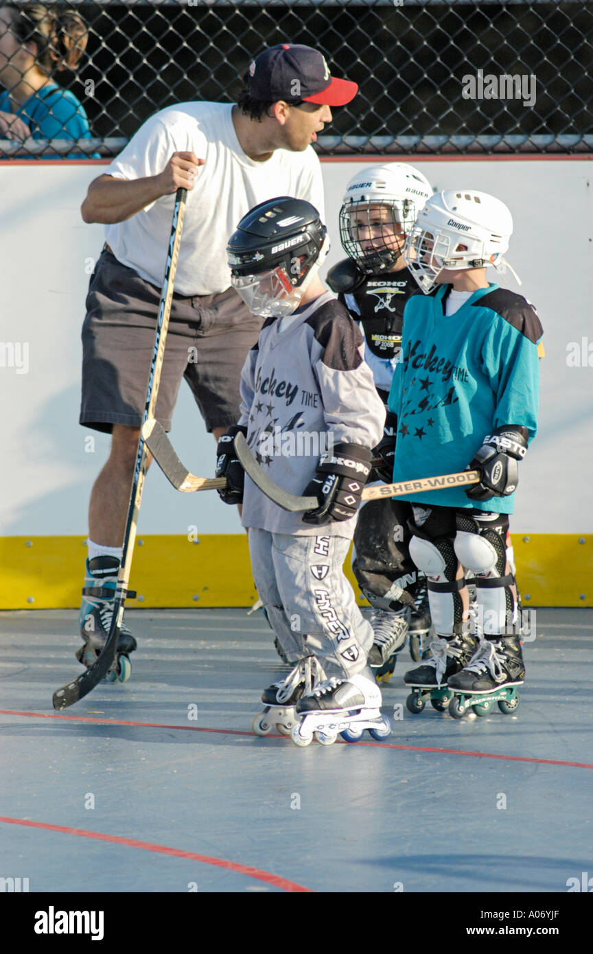 10 ten year old boy during practice with roller hockey team with full