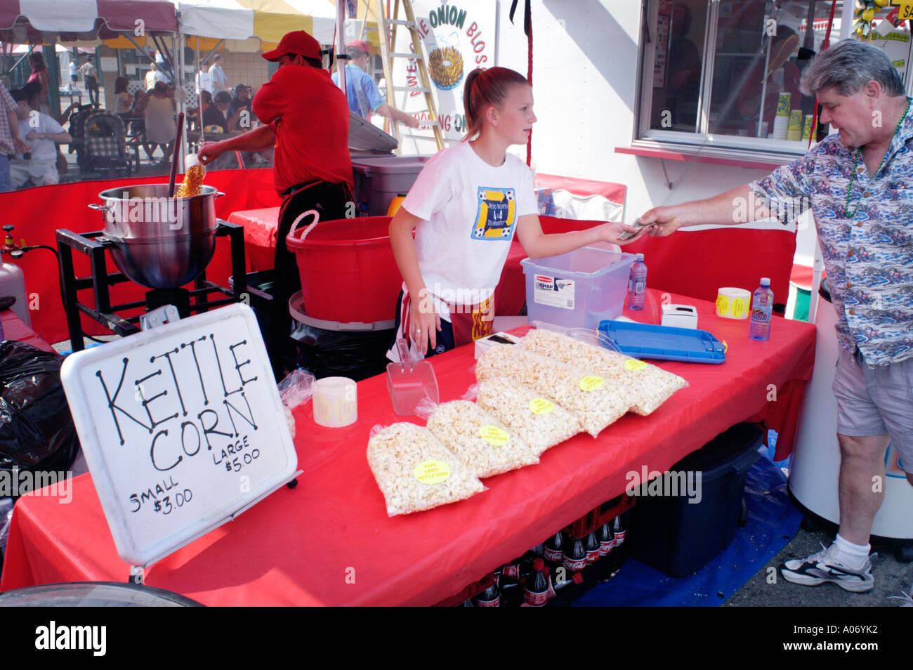 Man buying junk food at county fair kettle corn Stock Photo Alamy