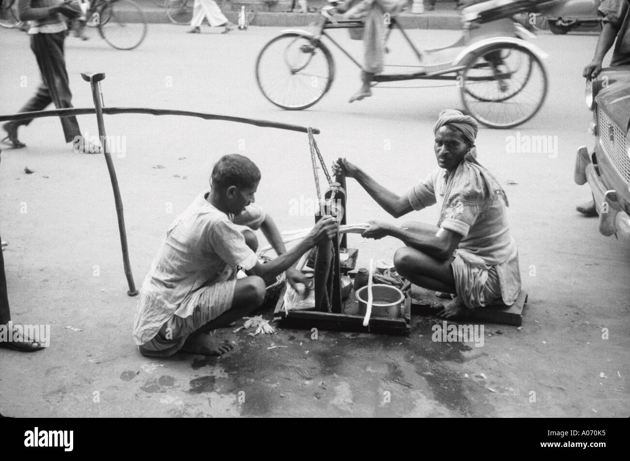 Old vintage 1900s photo of Sugarcane juice vendor in Lucknow Uttar Pradesh India Indian hawker Asia Asian vendor Stock Photo