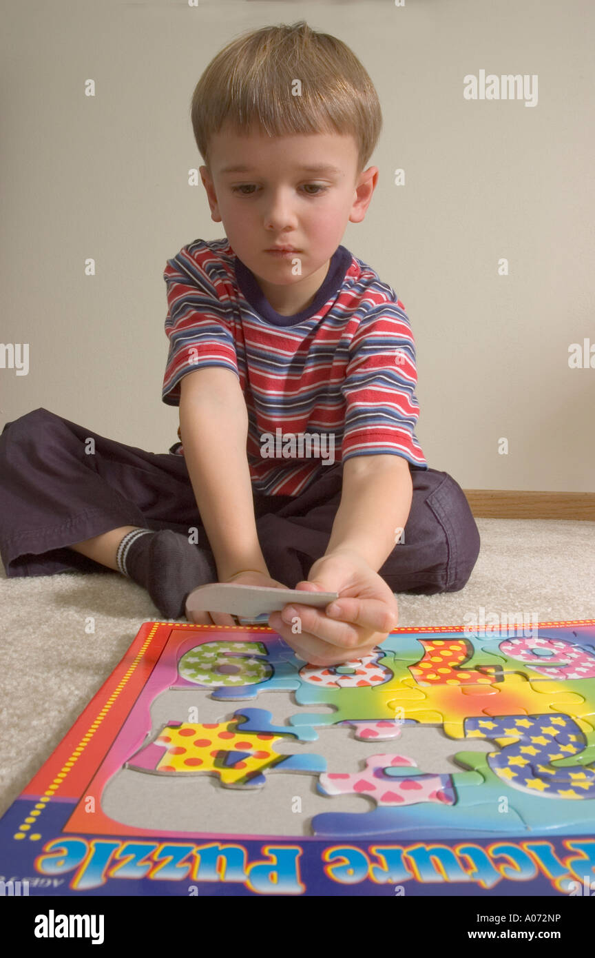 5 YearOld Caucasion Puts Together Puzzle 4 Stock Photo Alamy