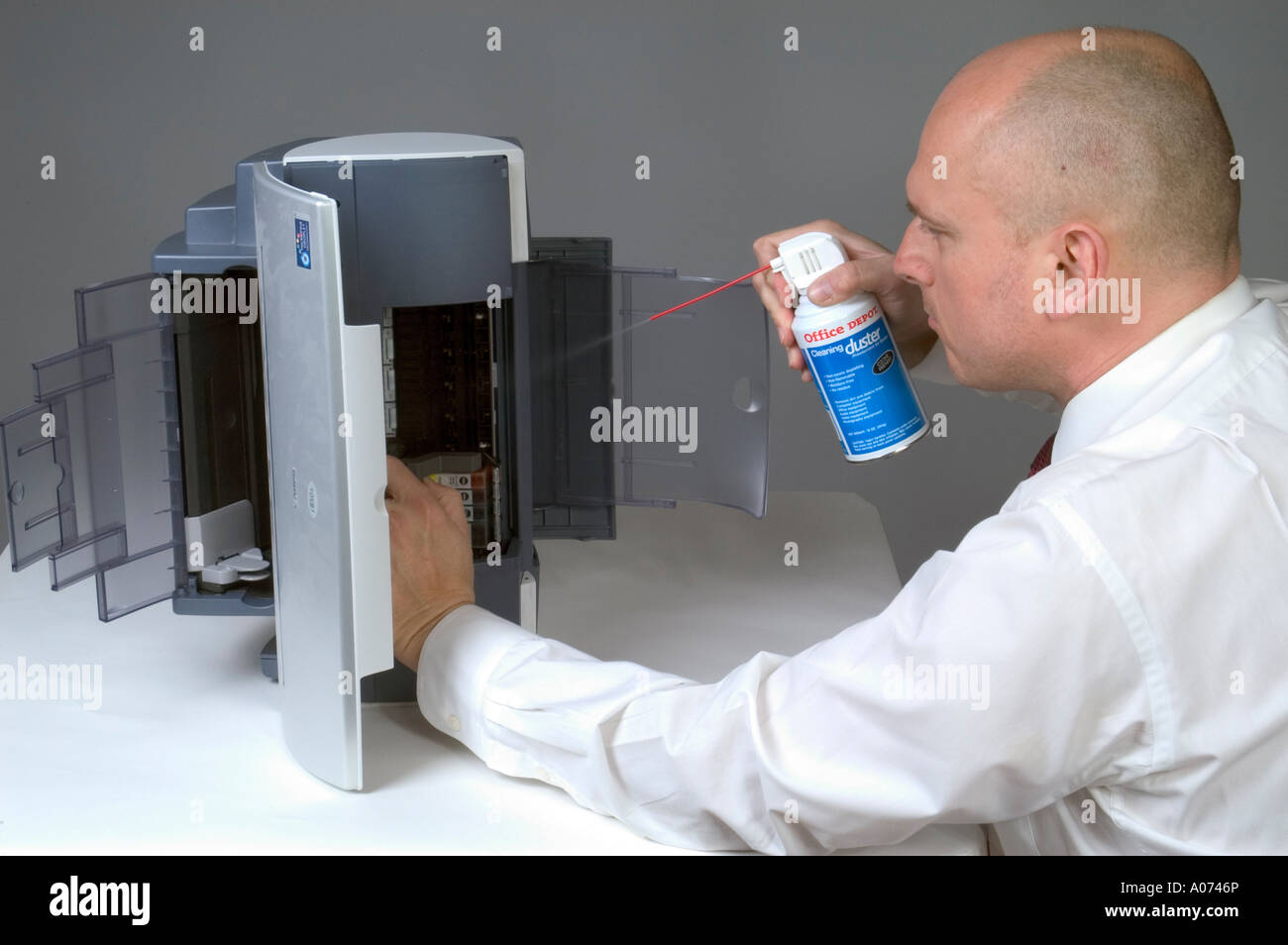 Man Cleaning Computer Printer With Compressed Air 2 Stock Photo Alamy