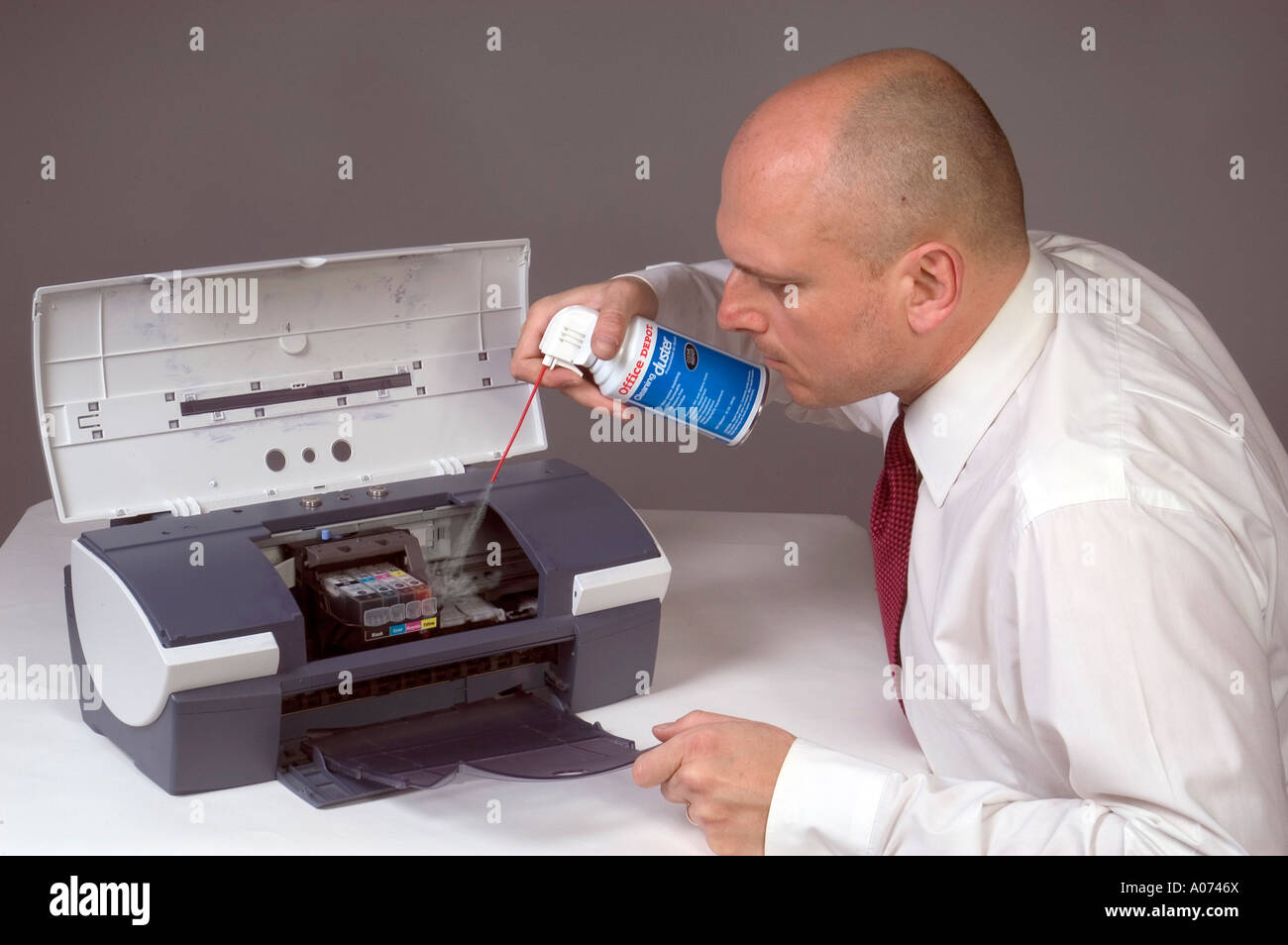 Man Cleaning Computer Printer With Compressed Air 3 Stock Photo Alamy