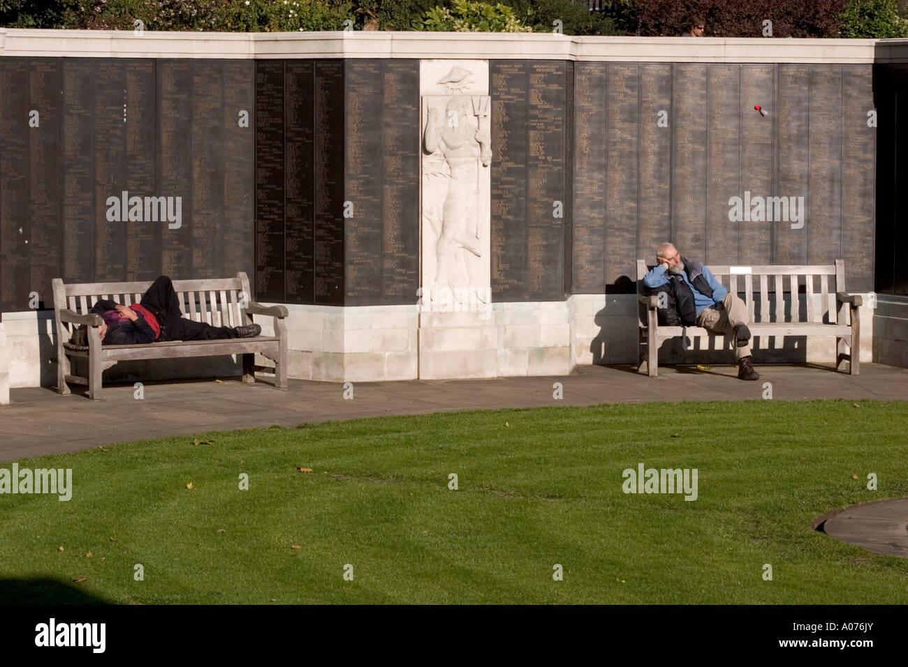 People Relaxing Asleep In Sun During Lunch Time Trinity Square
