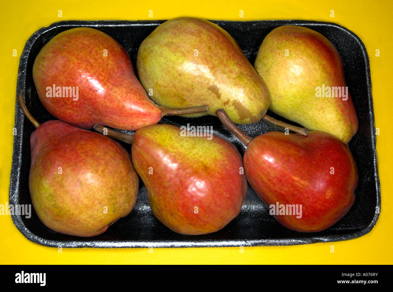 Packet of fresh pears. Five daily portions of fruit and or vegetables. Stock Photo