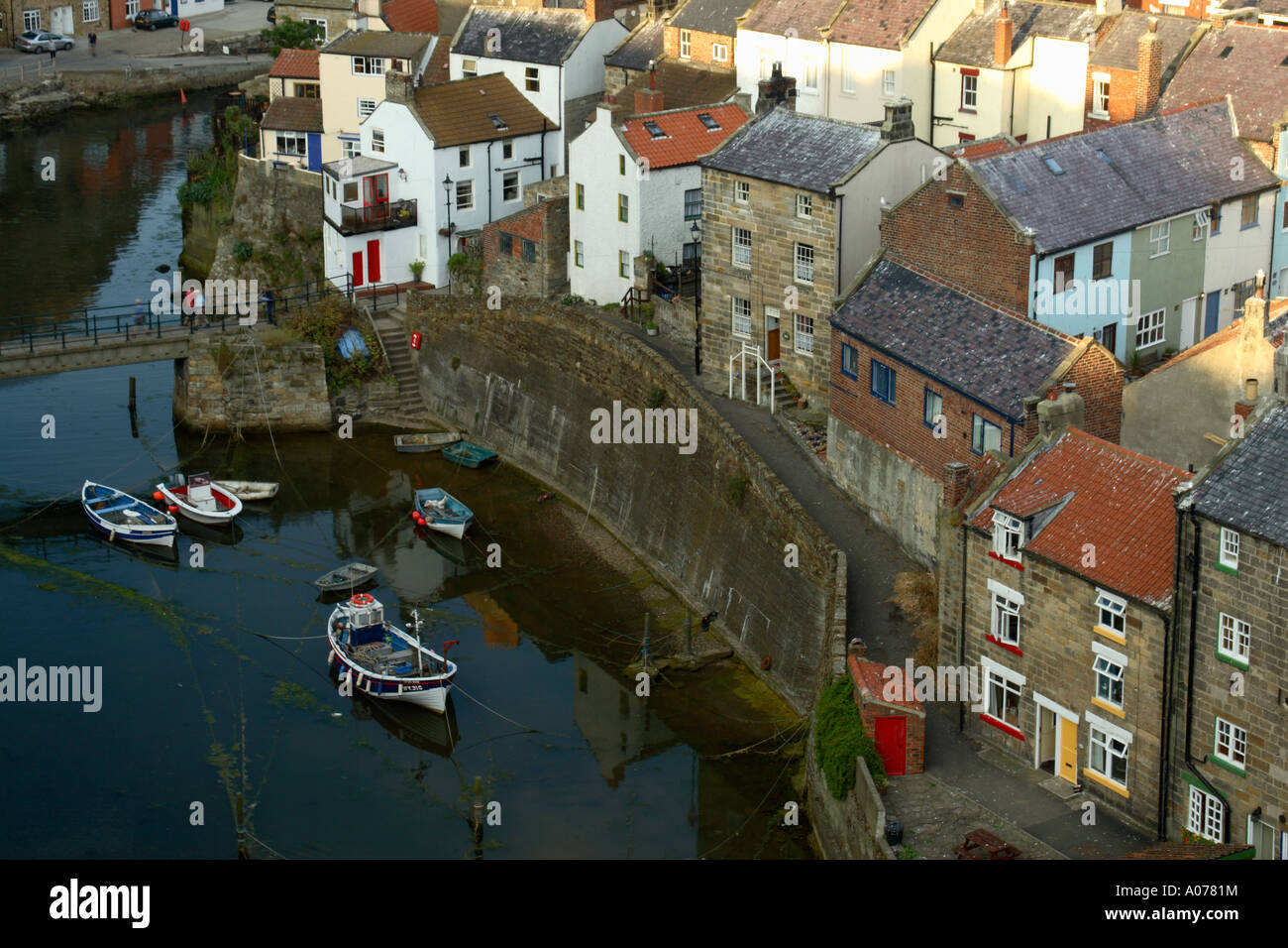 View Of North Yorkshire Fishing Village Staithes Showing Boats In
