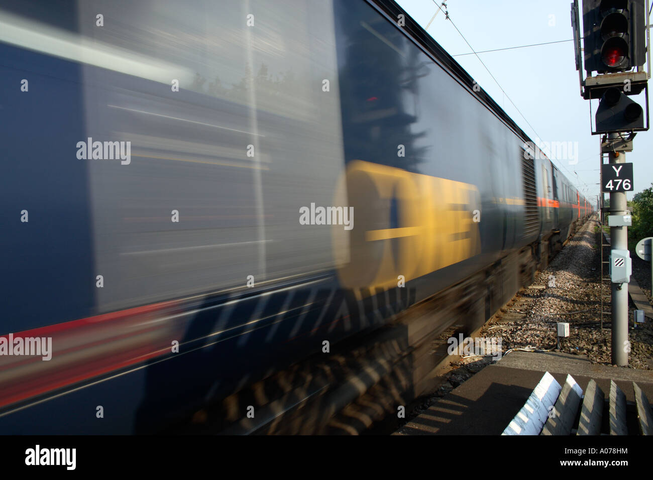 High speed train on East Coast main line passing through a rail station at Northallerton Stock Photo