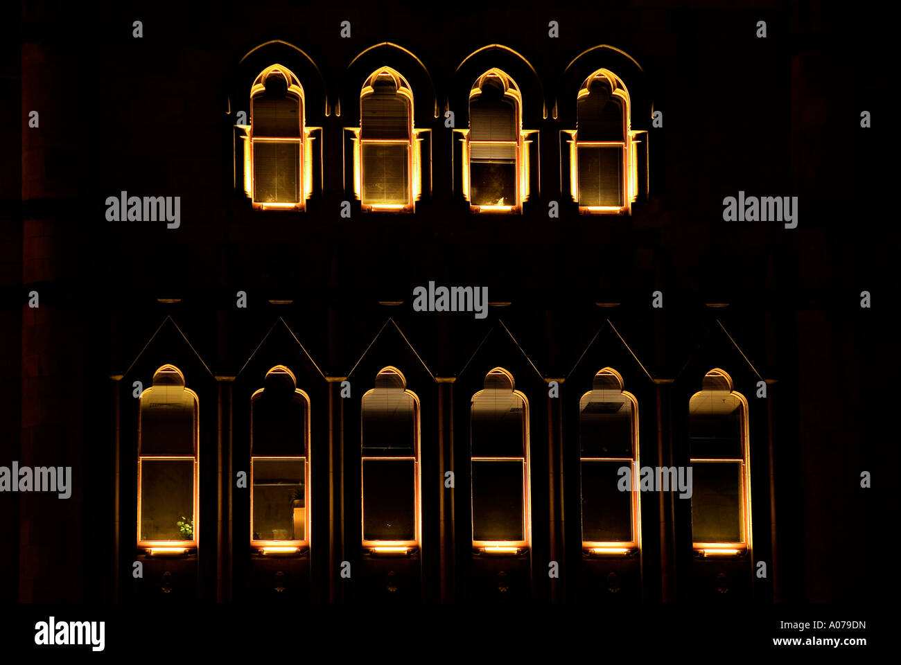 windows lit up in the dark Stock Photo