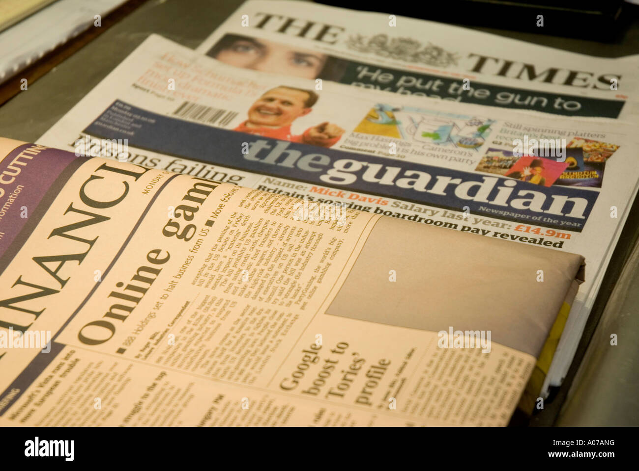 A selection of British broadsheet newspapers on a table in London