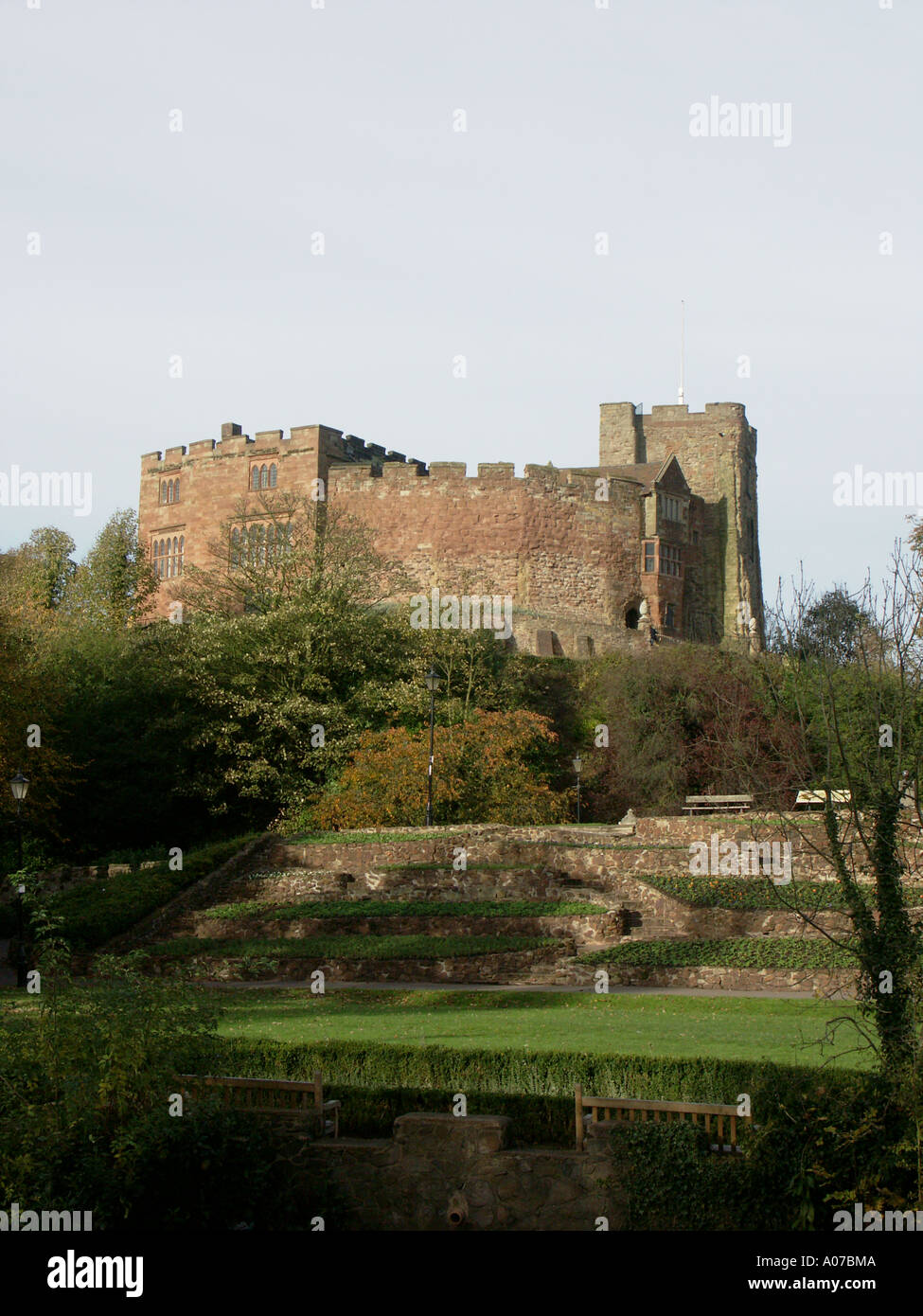 Tamworth Castle and gardens viewed from across the River Anker in the Castle Grounds. Stock Photo