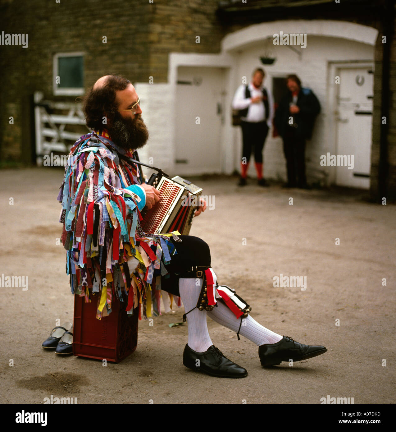 Traditions man playing accordion accompanying Morris Dancers Stock Photo