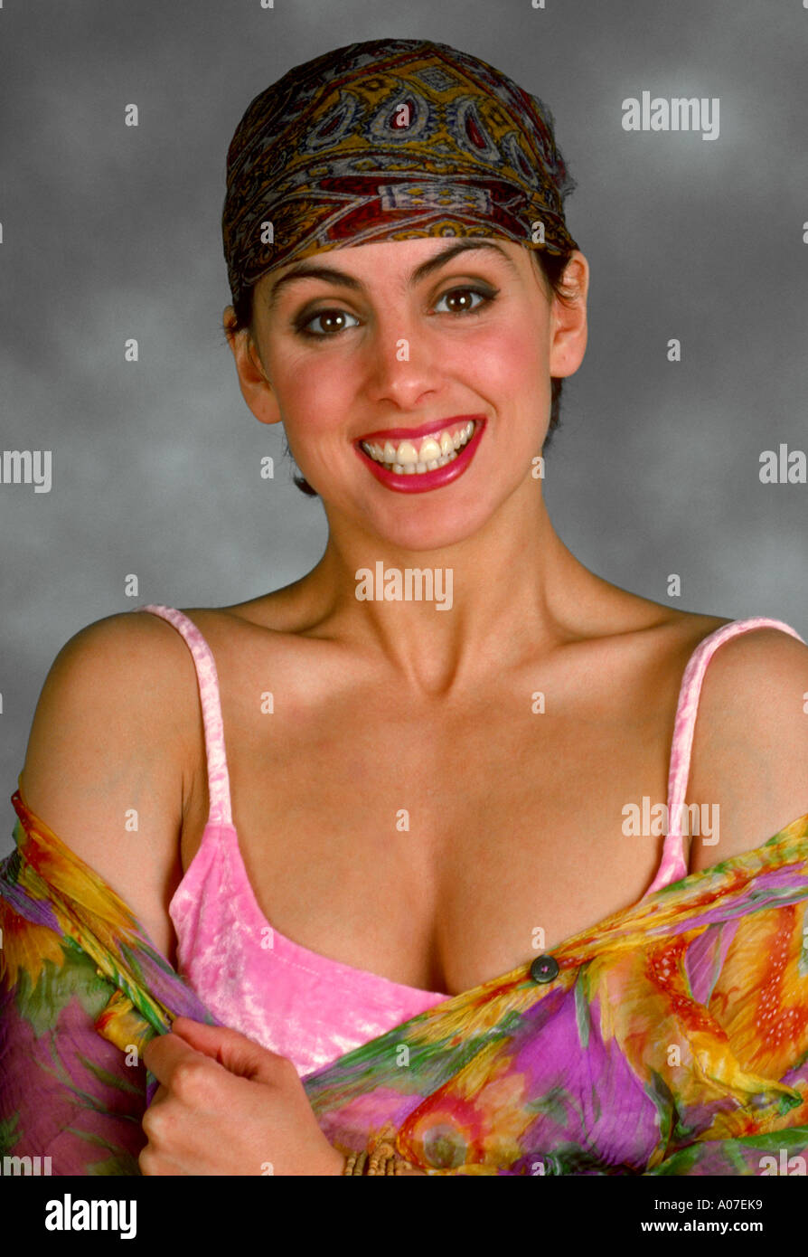 Portrait of a Smiling Young Woman Wearing a Headscarf Stock Photo