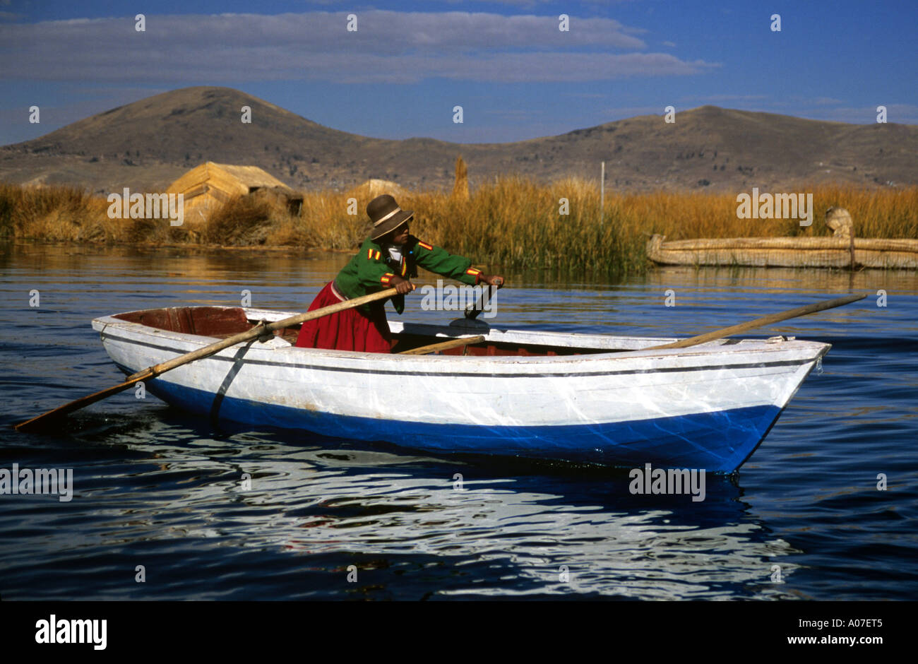 Rowing boat on Lake Titicaca, Uros Floating Islands, Peru Stock Photo