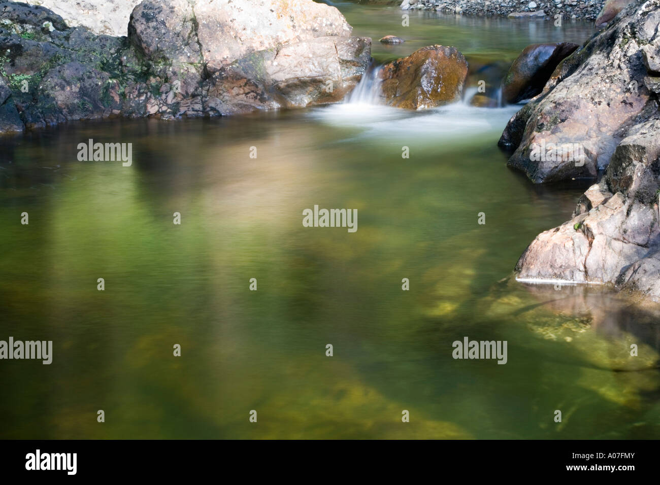 Reflective water in burn, Lochdon, Isle of Mull, Scotland, United Kingdom Stock Photo