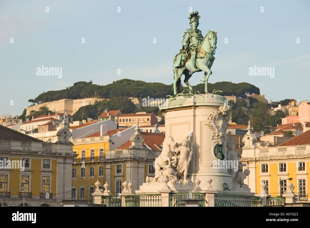 Lisbon Portugal Praca do Comercio and view to Castelo de Sao Jorge Statue of King Jose I Stock Photo