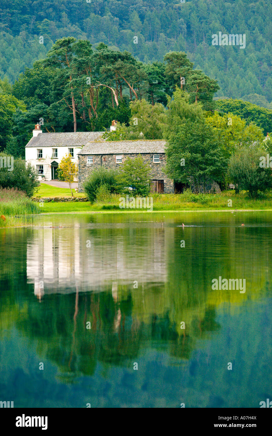 Derwent Water Lakeland Stone Cottages Reflected Onto The Lakes