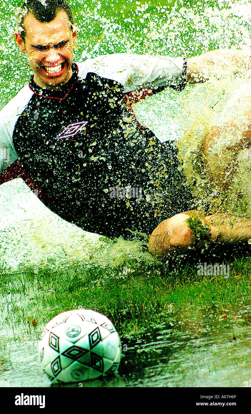 Action, Effort, Challenge, Sport, Horizontal, Full Length, Outdoors, 30-34 Years, Front View, Football, Caucasian Appearance, Ju Stock Photo