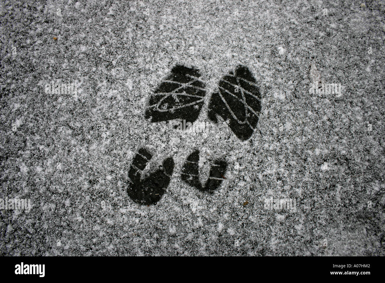 shoe prints in snow. (c) by uli nusko, ch-3012 bern Stock Photo