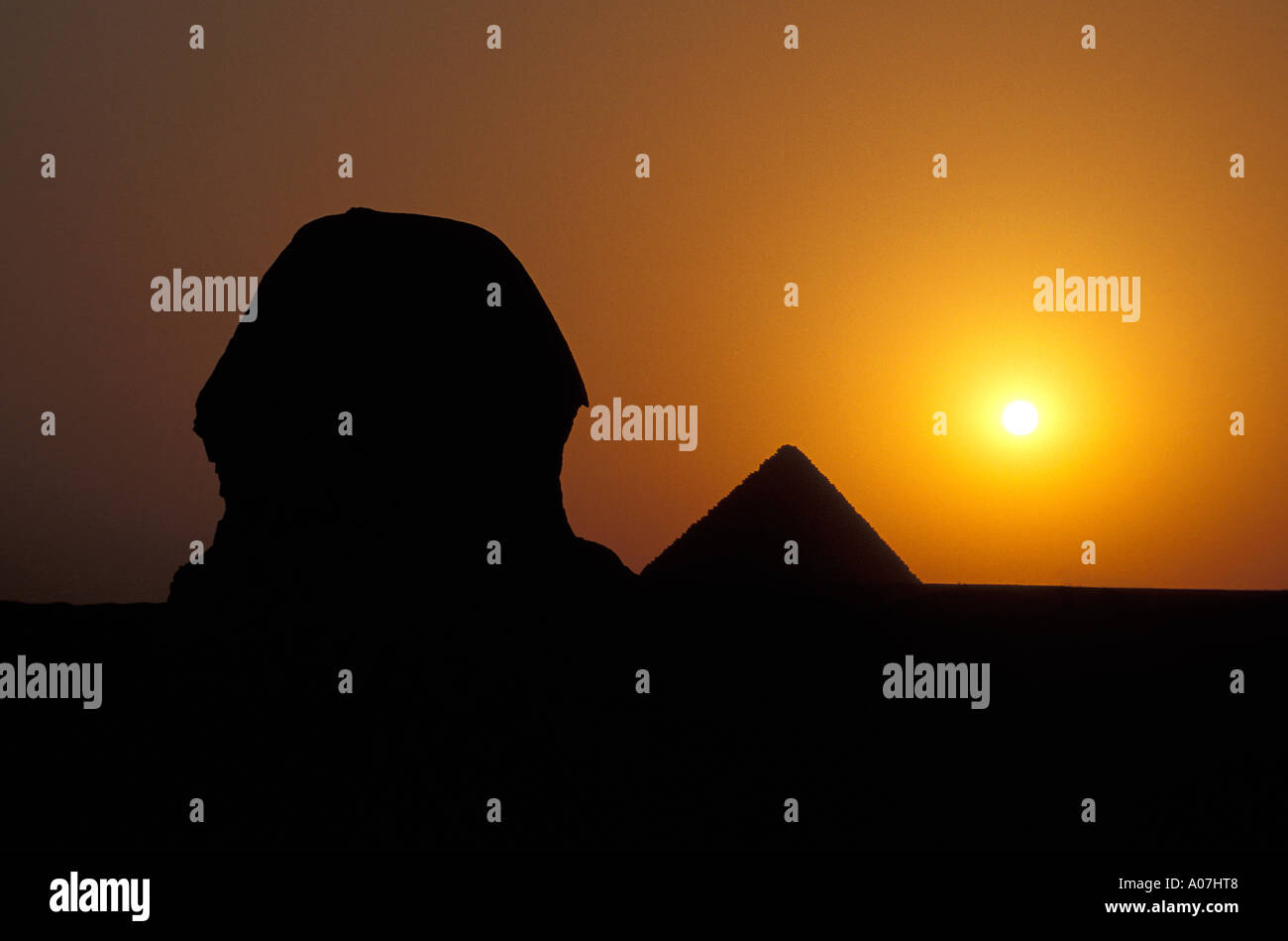 The Sphinx and Pyramids of Giza at Sunset, Egypt Stock Photo