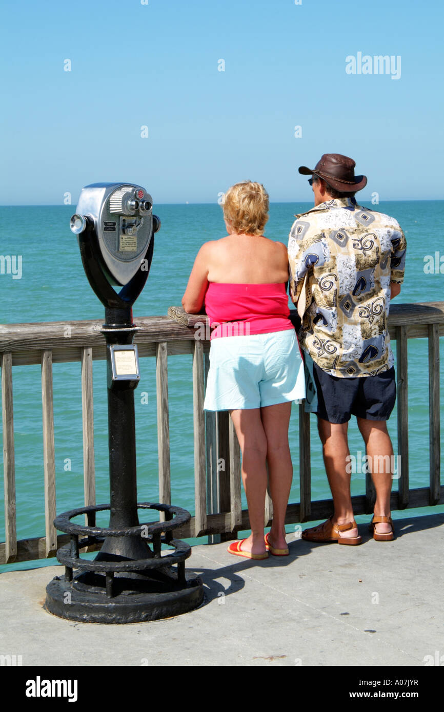 Clearwater Beach.Pier 60 holidaymakers look out to sea.Long range binocular machine. Stock Photo